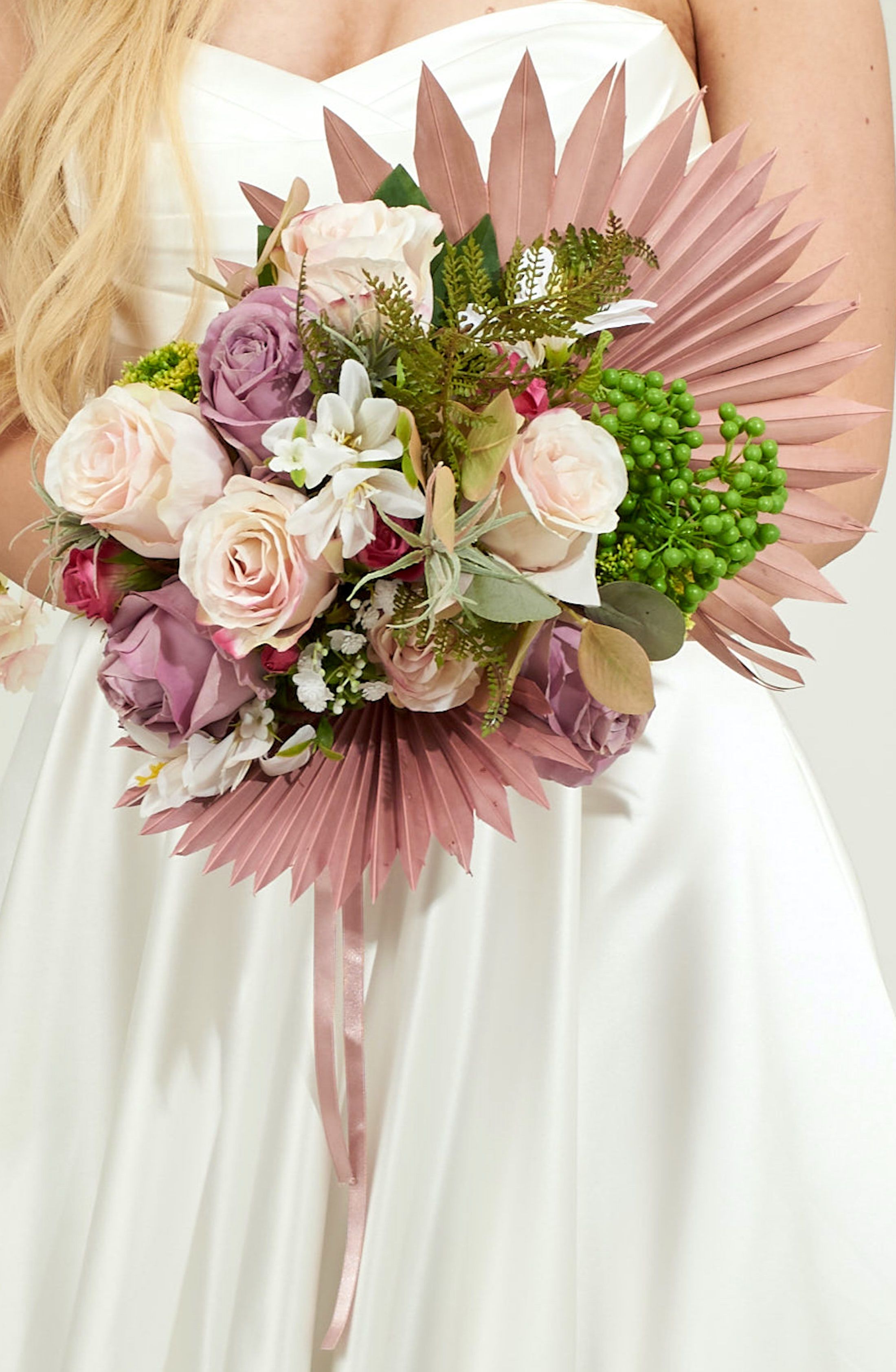 Artificial flowers bouquet with dried palm spears