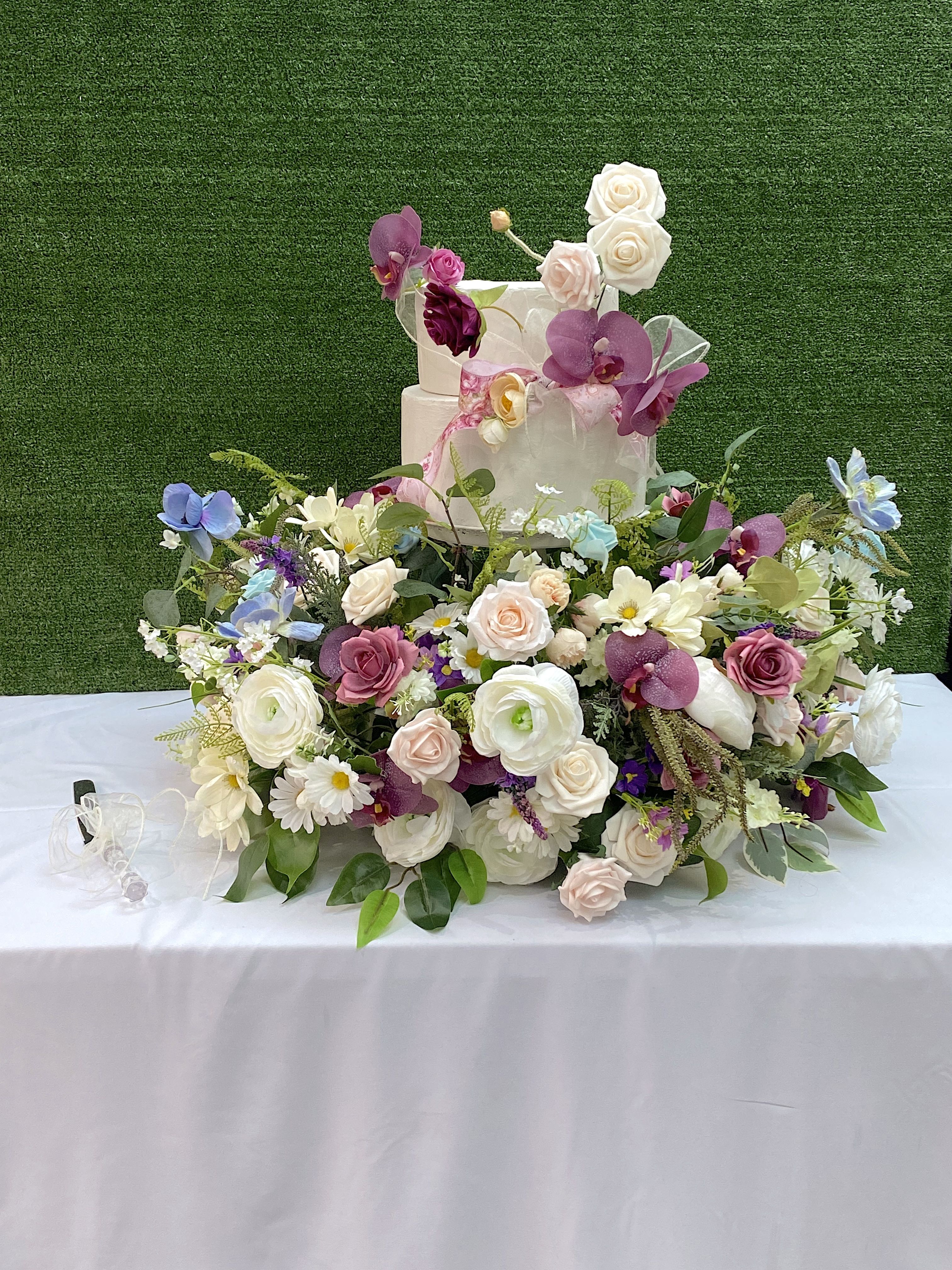 Cake Meadow with Artificial Flowers Wedding Trend 2024