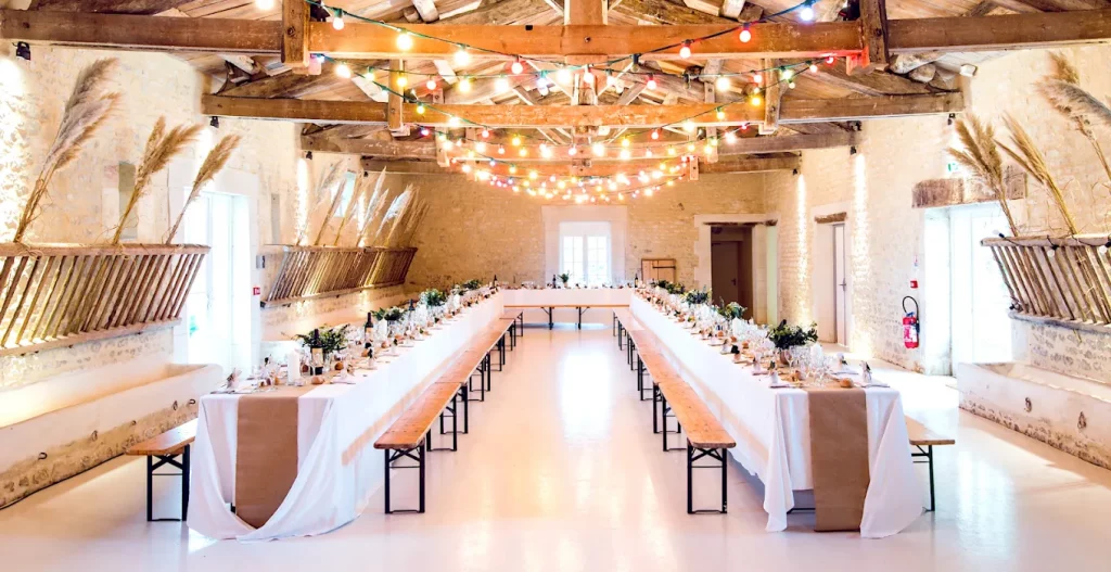 Elegant corporate event styling with floral centrepieces, branded décor, and modern table settings for a professional business event.