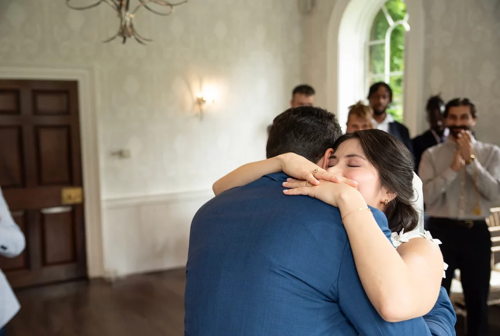 Romantic anniversary celebration setup with elegant floral arrangements, candlelit table, soft lighting, and stylish decor creating an intimate atmosphere.