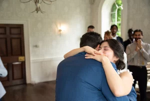 Romantic anniversary celebration setup with elegant floral arrangements, candlelit table, soft lighting, and stylish decor creating an intimate atmosphere.